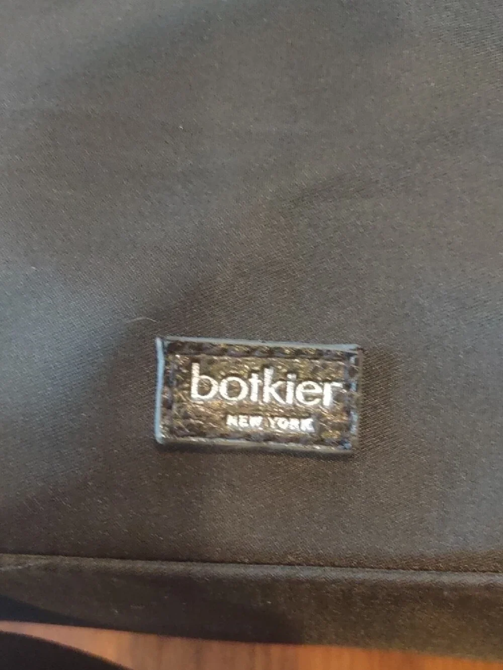 Botkier Black Backpack with Textured Flap, Adjustable Straps And Zip Pockets